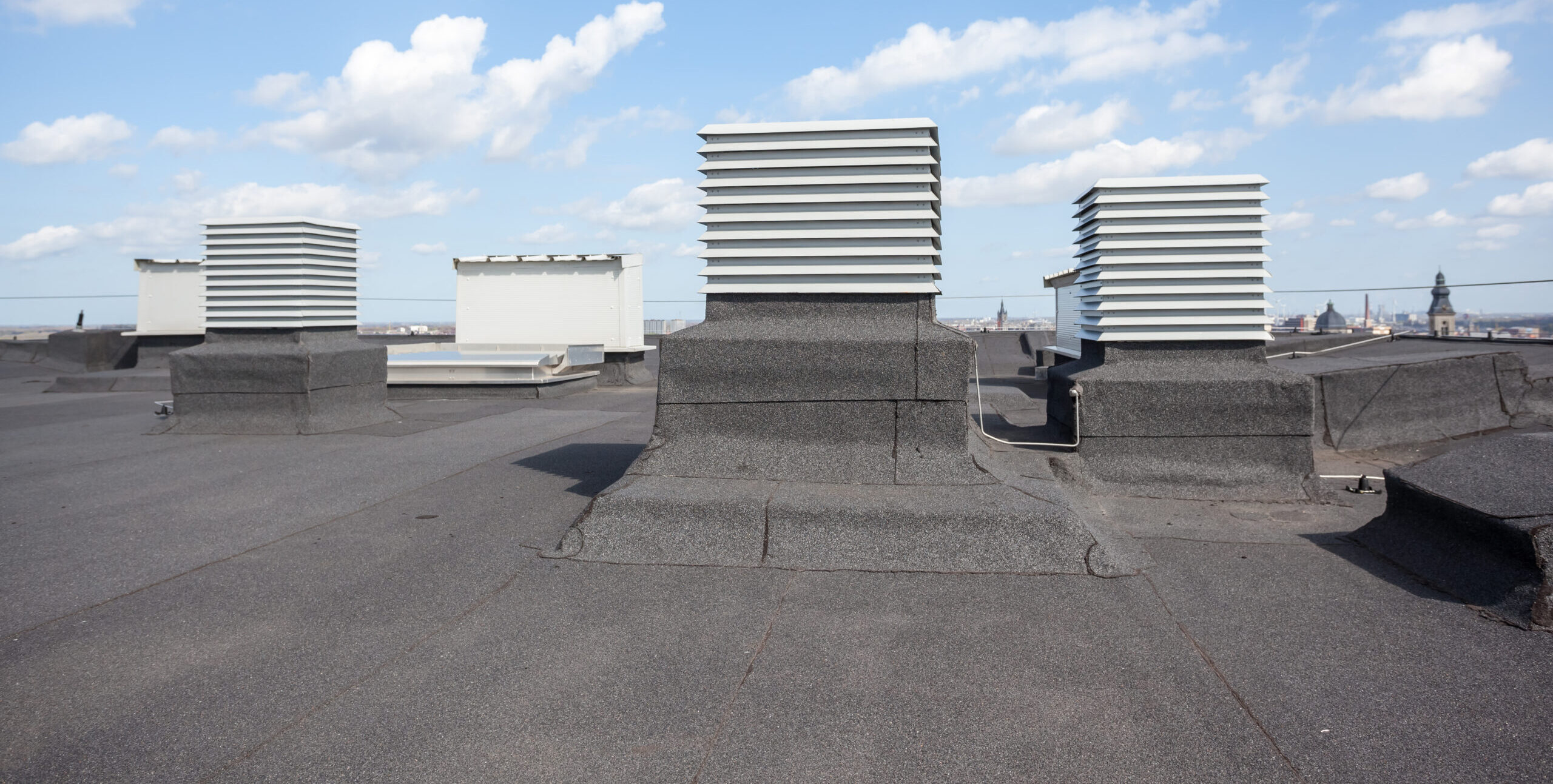 commercial roofing Jacksonville FL - Air conditioning units on a flat roof in Jacksonville, FL, showcasing commercial roofing